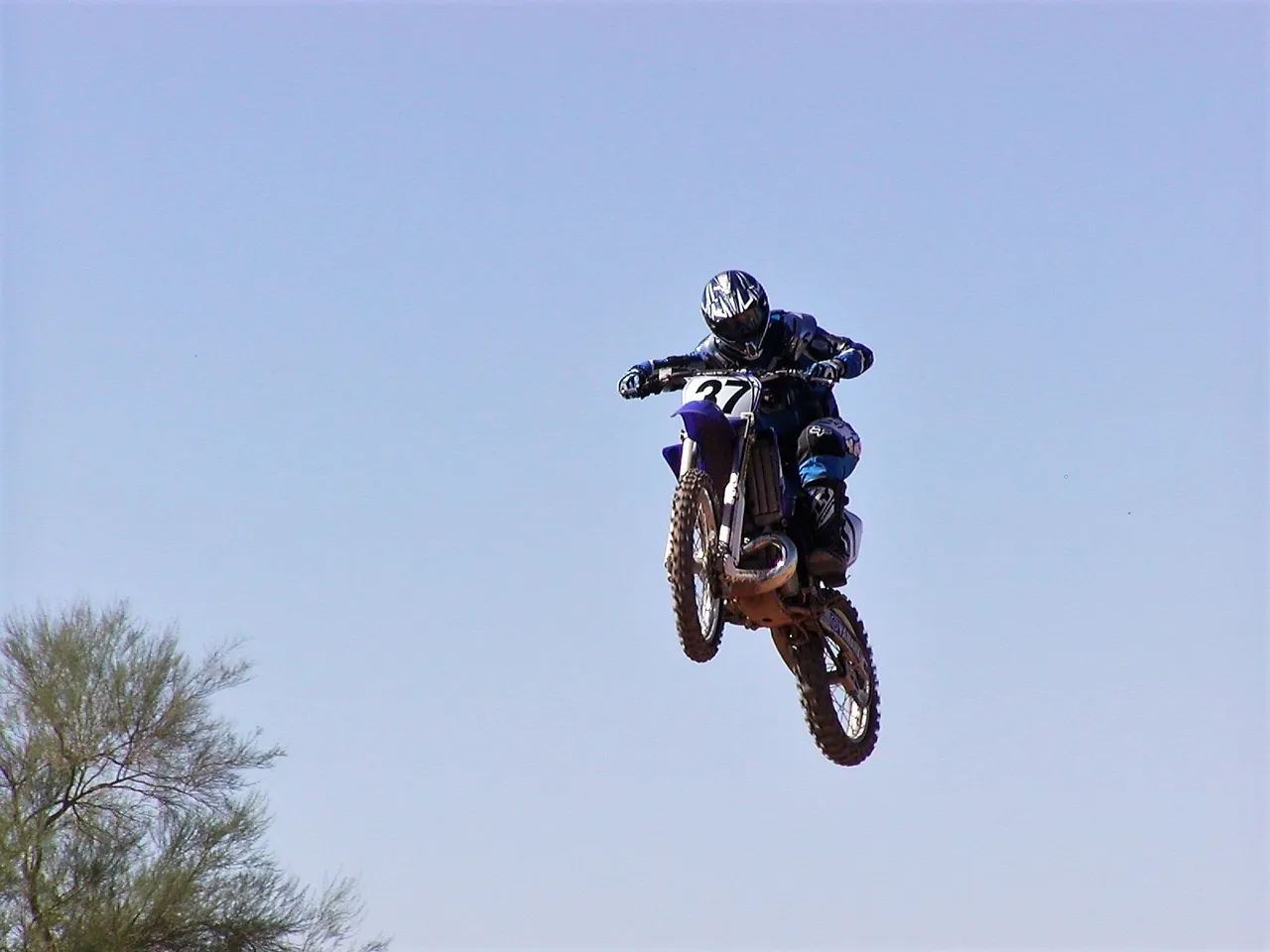 A person on a motorcycle jumping in the air.