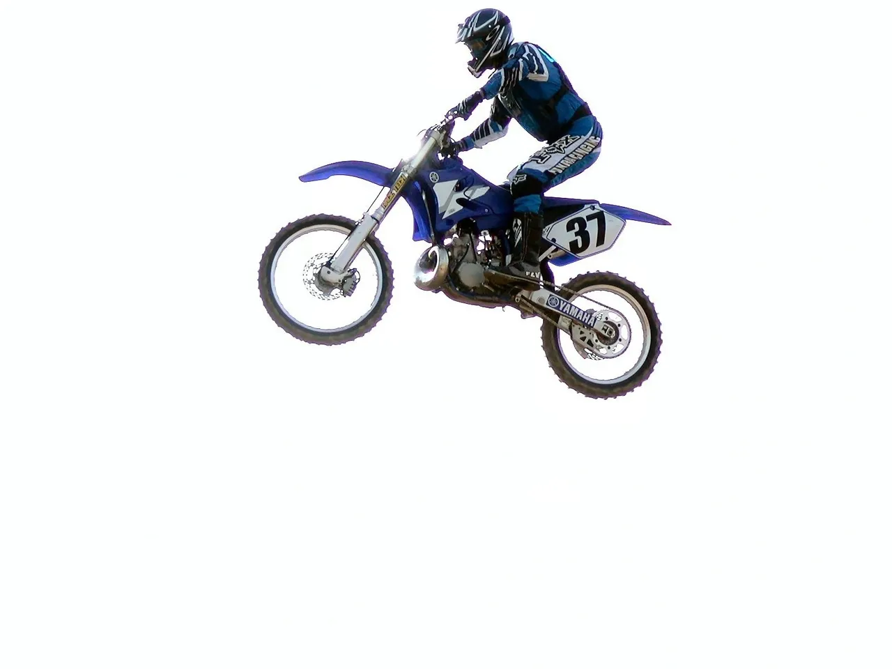 A person on a motorcycle jumping in the air.