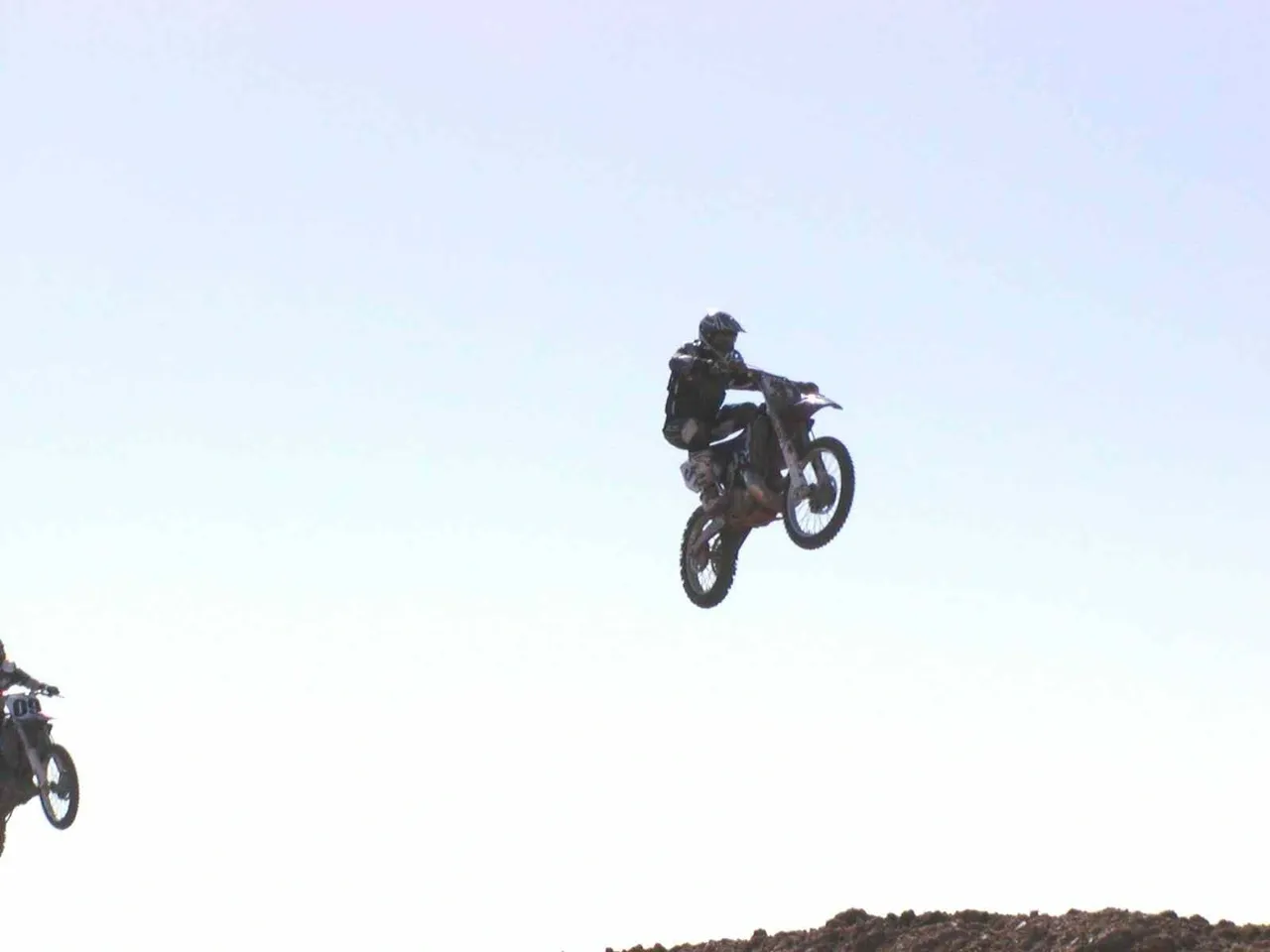 A person on a motorcycle jumping in the air.